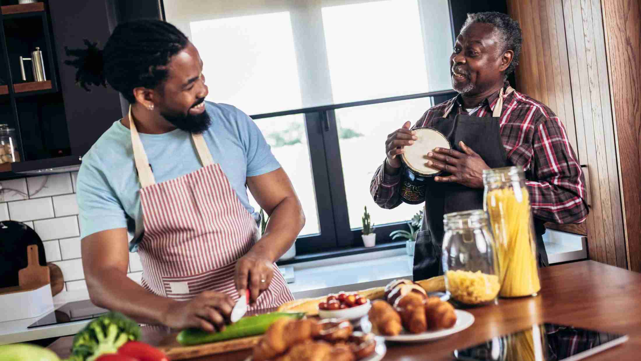 Men cooking healthy in kitchen to support bladder health